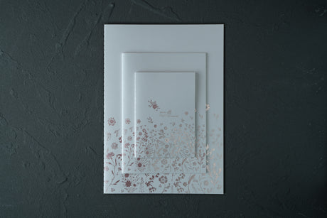 A6, A5, and A4 floral fountain pen notebooks in Snow, shown in a stacked size comparison (hover view) — Rehiie Notebook Light.